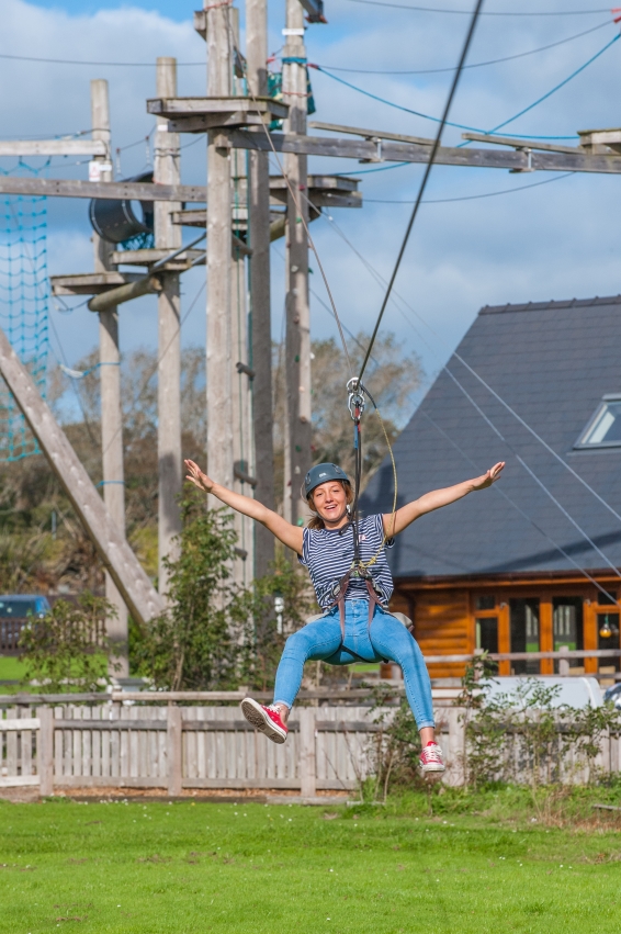 Zipline fun at Tree Tops Trail high ropes adventure - Tenby, Pembrokeshire, South West Wales